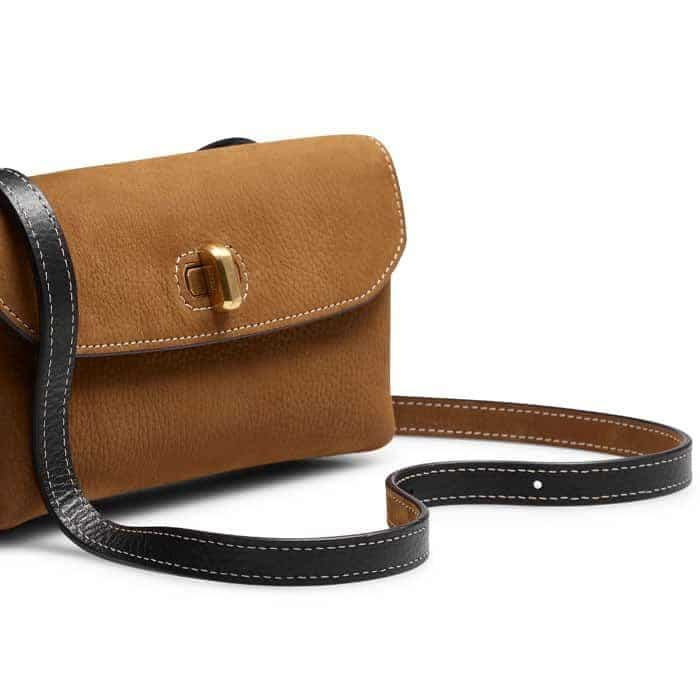 The adjustable strap allows you to wear it crossbody or on the shoulder.