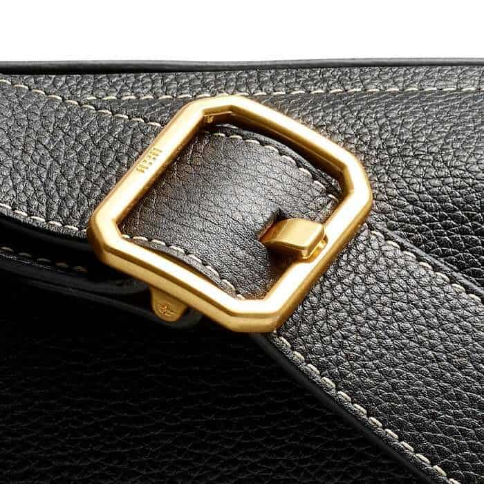 The gold-plated buckle is elevated with abstract ME+EM block branding.