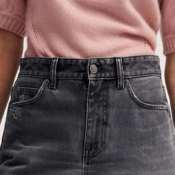 A classic five-pocket construction adds functionality to the piece.