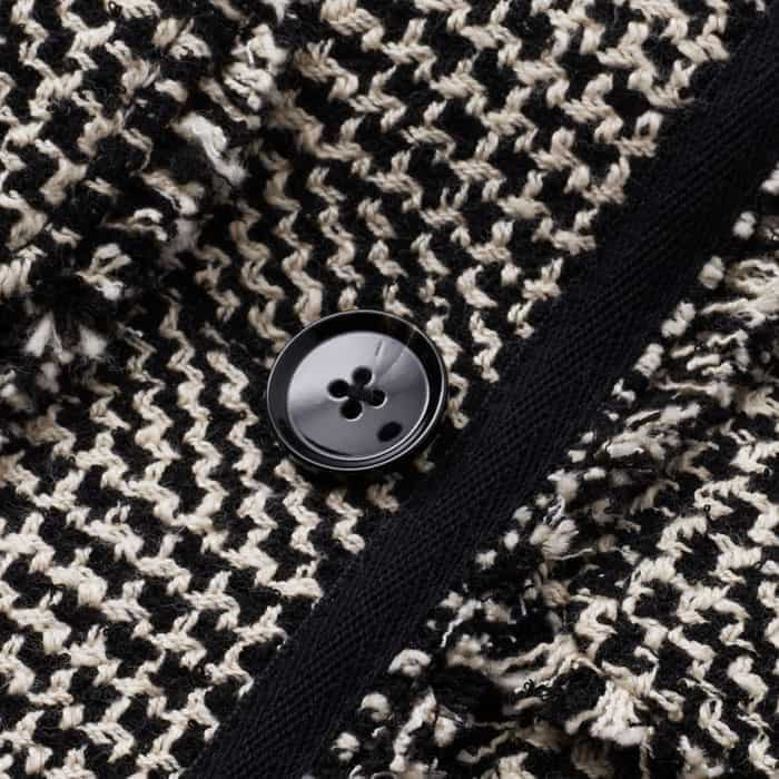 Made from a textured cotton wool blend fabric in a black and ivory colour palette.