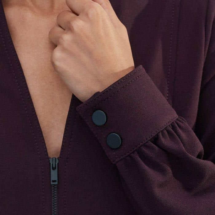 The cuffs are signed off with contrasting black buttons so the sleeves can be turned back.