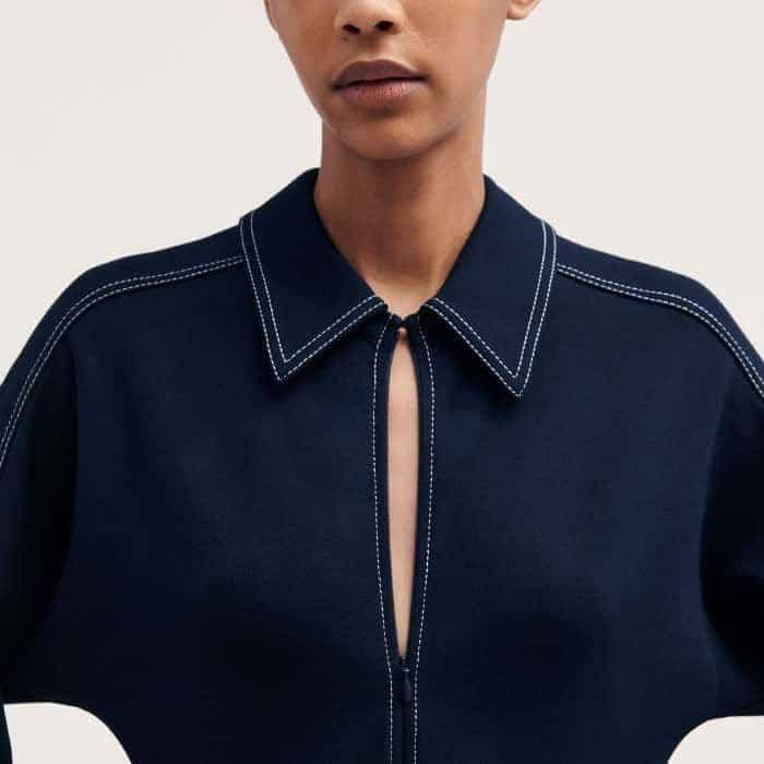 A zip detail and hook-and-eye fastening allow you to customise the finish of the neckline.