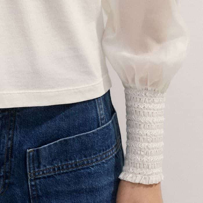 The deep-smocked cuffs maintain the shape of the balloon sleeves.