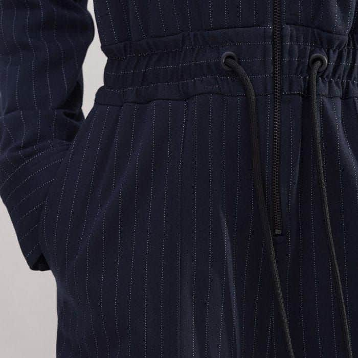 Generously sized patch pockets are cleverly placed to keep a streamlined silhouette.