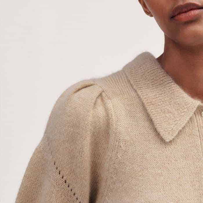 A pouf at the shoulder adds flattering volume to the sleeves.