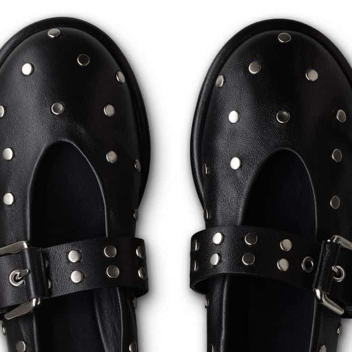 The shoe and buckle are elevated with matte silver-toned studs.