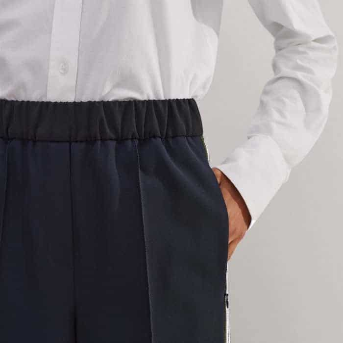 Pockets are positioned in front of the side stripe for a bulk-free finish.