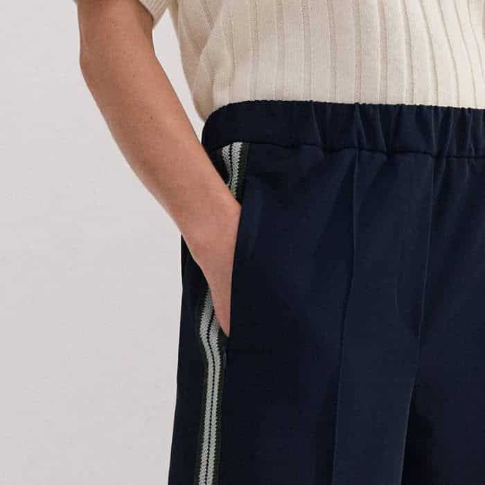 Pockets are positioned in front of the side stripe for a flattering bulk-free finish.