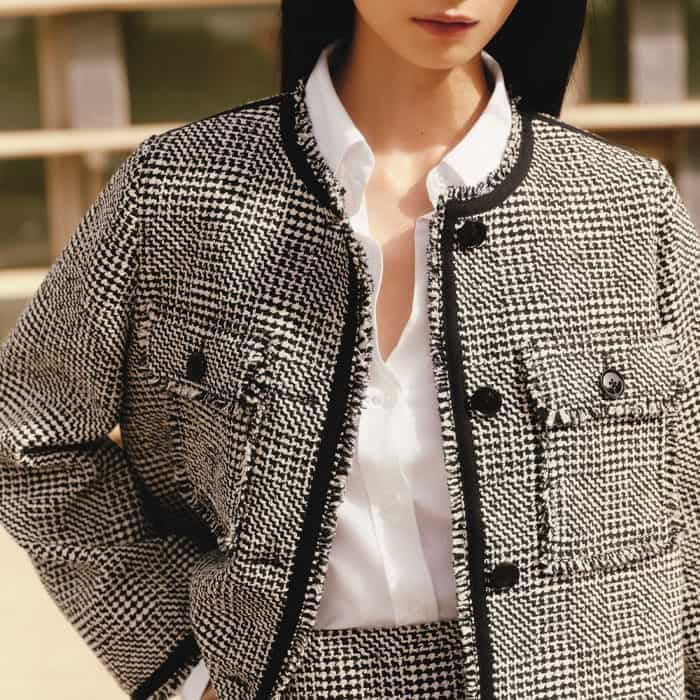 Build a monochromatic look with the coordinating Textured Swing Jacket.