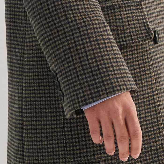 Three buttons line the cuffs and accommodate layering.