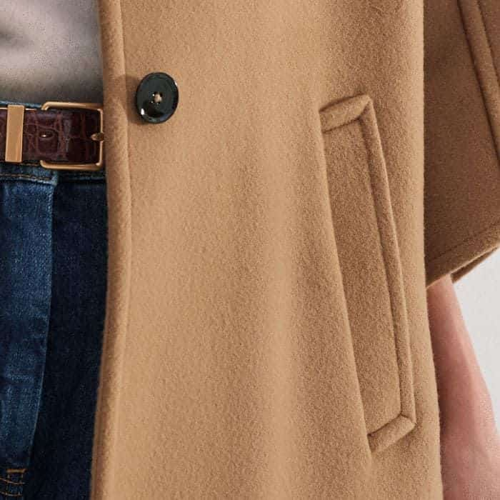 Functional pockets are positioned either side of the button-down front for a bulk-free finish.