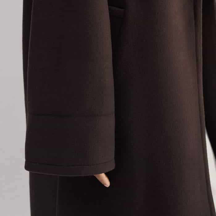 The cuffs can be turned back to shorten the length of the sleeves.