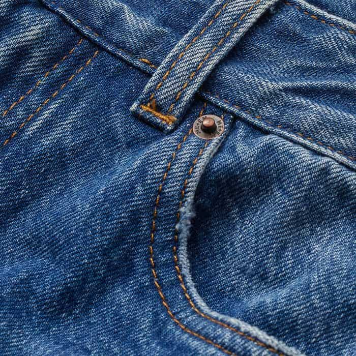 Crafted from Italian cotton denim, washed to a mid-blue with pressed creases at the front for additional polish.