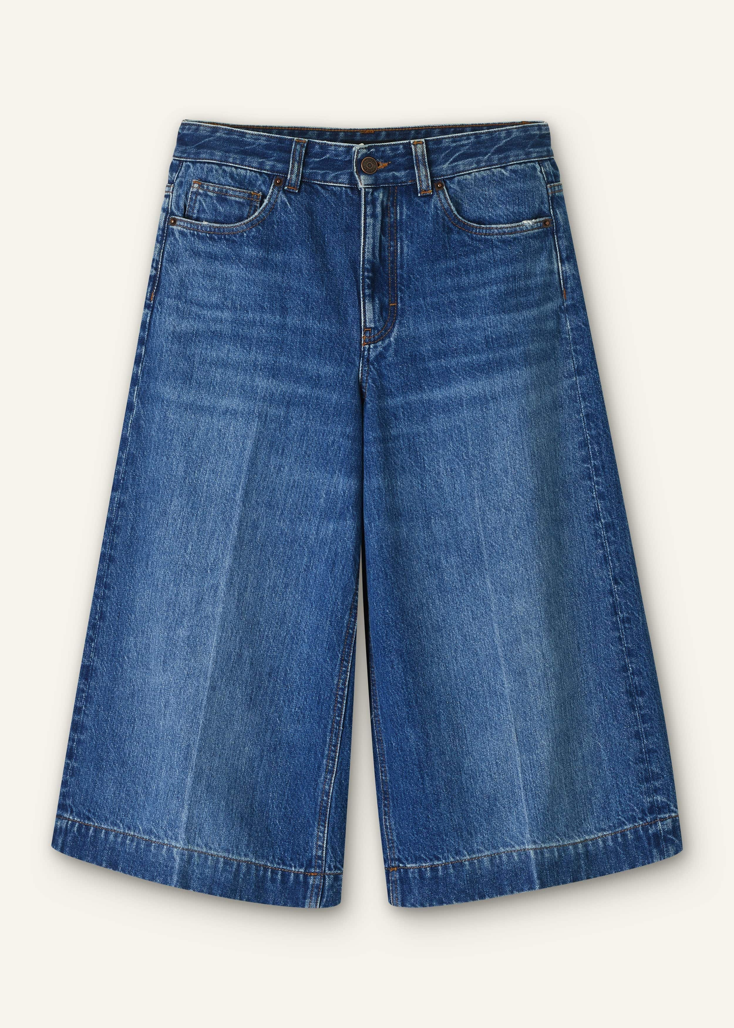 Crafted from Italian cotton denim, washed to a mid-blue with pressed creases at the front for additional polish.