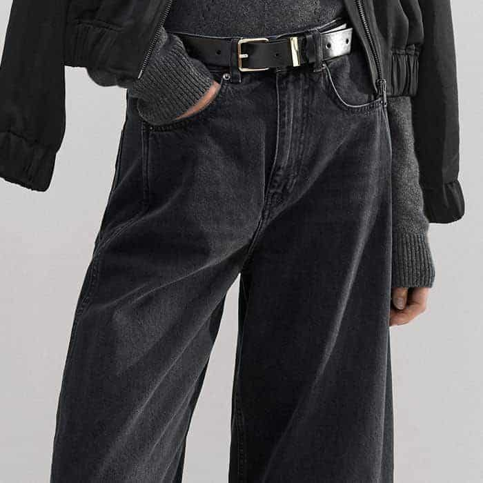 The washed black denim is a versatile canvas for outfit building.