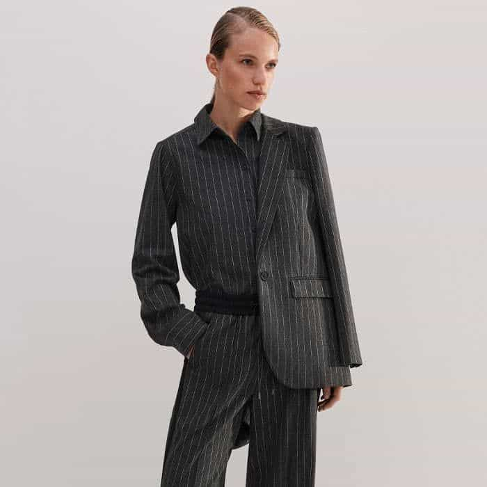 Build a three-piece set with the coordinating Pinstripe Tailored Vest and Pinstripe Tapered Track Pant.