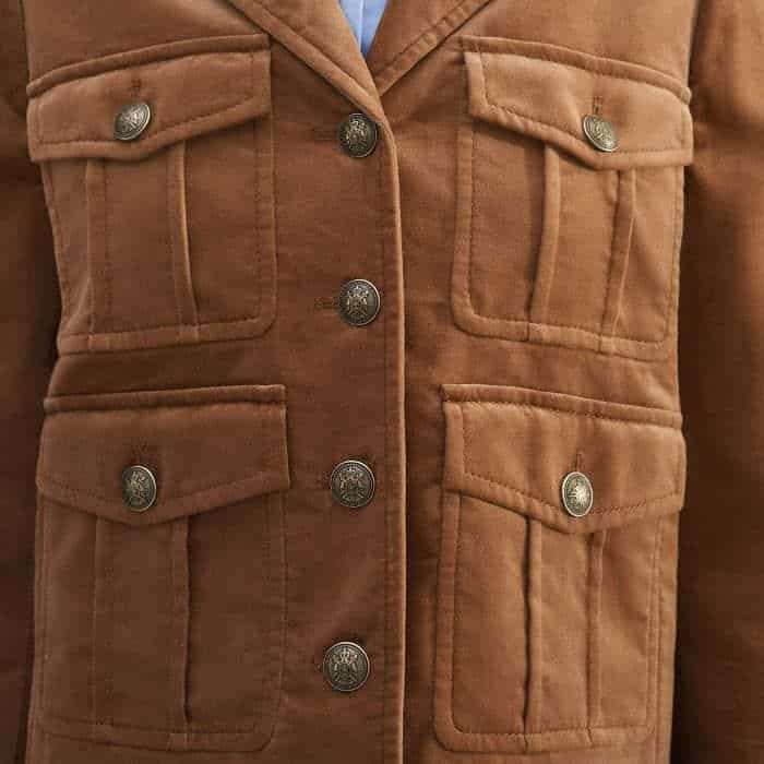 Four pockets across the front of the piece add functionality.