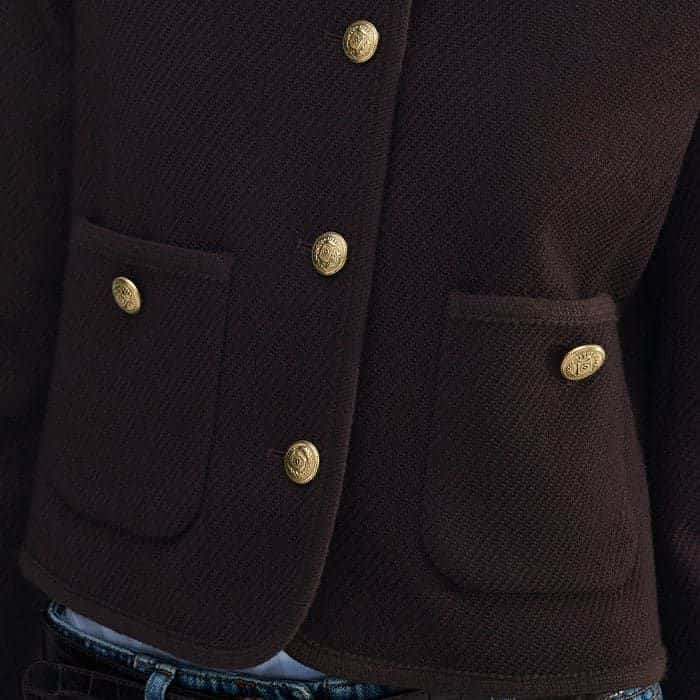 The pockets are elevated with gold-toned Italian buttons.