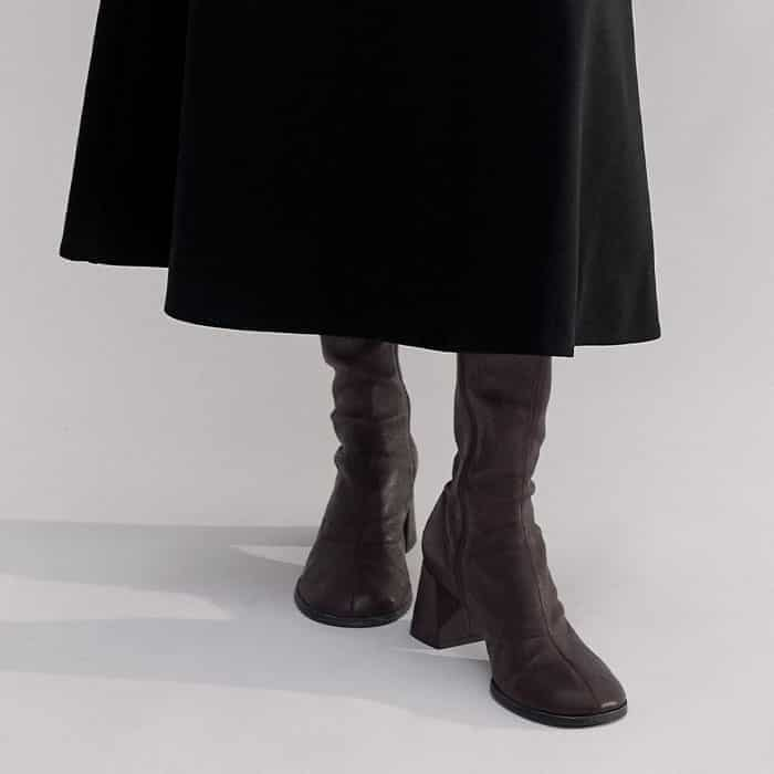 Our Stretch Knee-High Boot complements the midi length.