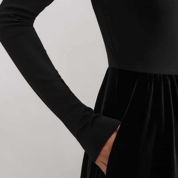 The structured ponte of the top contrasts with the velour jersey skirt for a flattering texture clash.