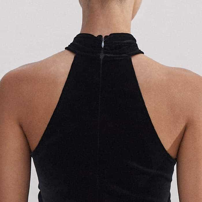 The zip is placed at the back of the piece to keep the front free from detail.