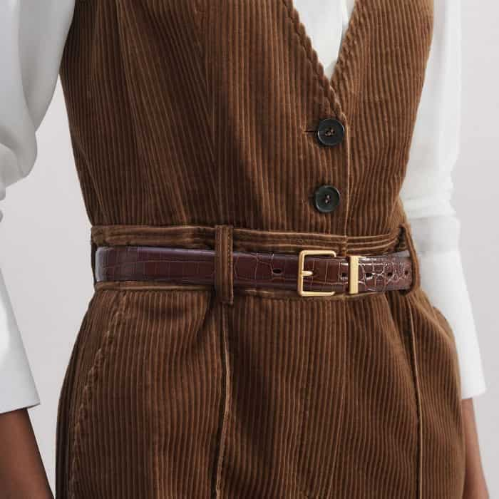 Add a belt to your waist to cinch in your silhouette.