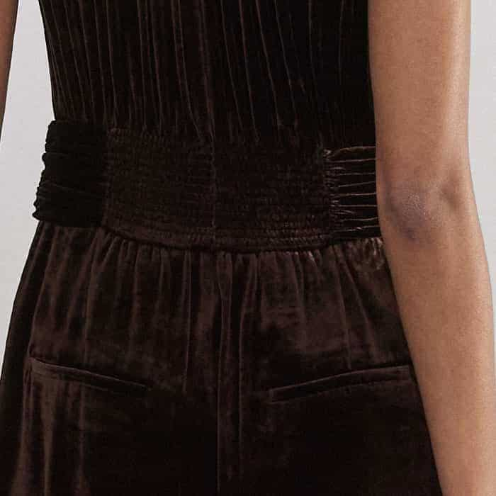 To create a subtly more defined waist, the back is detailed with a shirred panel.