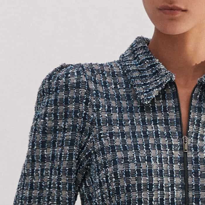 A pouf at the shoulder adds flattering volume to the sleeves.