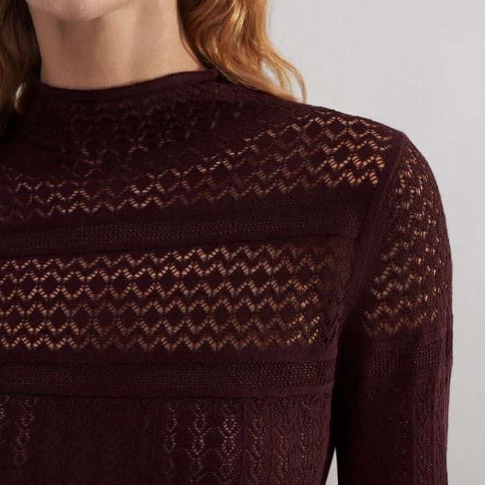 The pointelle knit stitch creates an elevated, graphic finish.