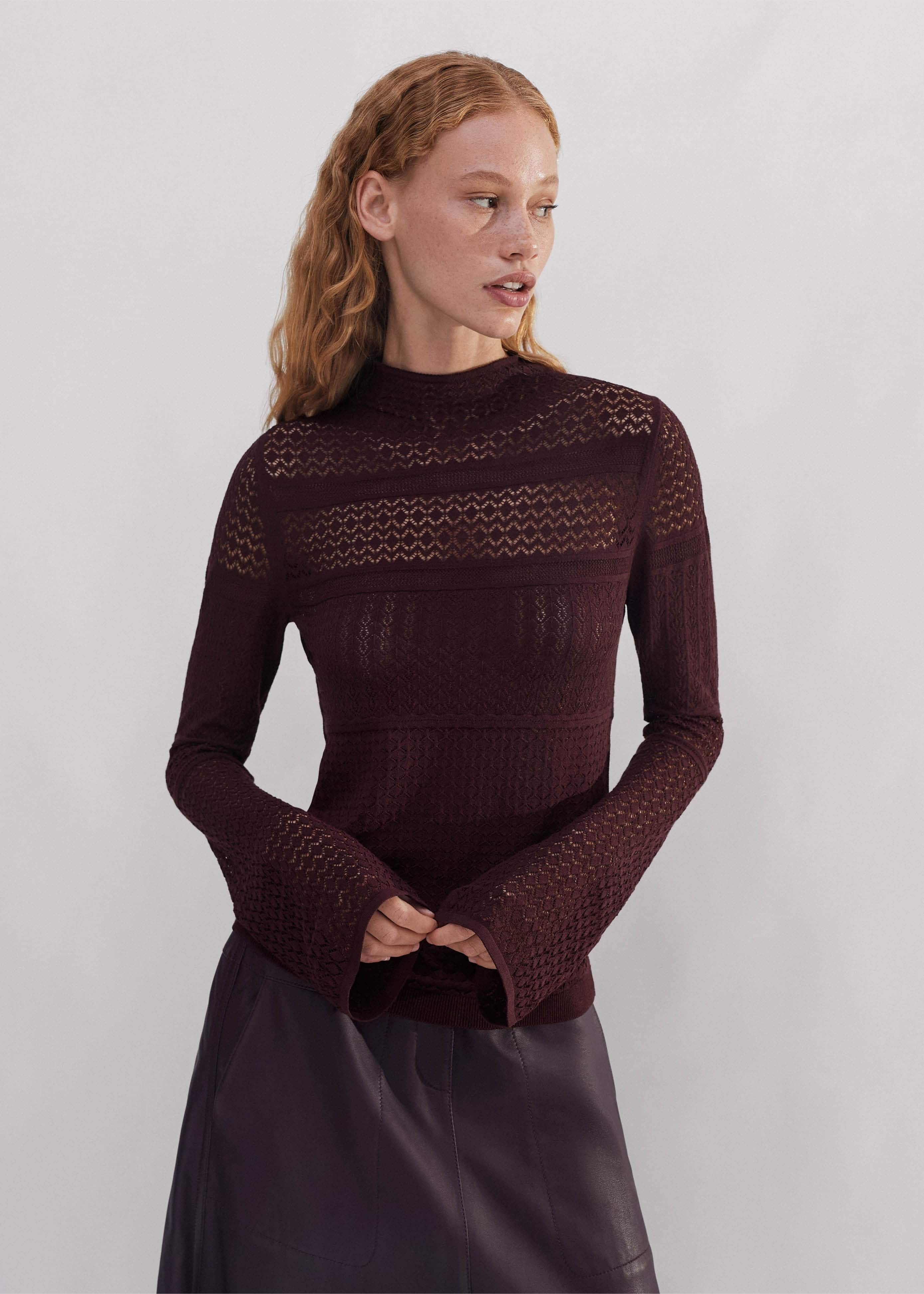 Crafted from viscose blended with polyester for improved stretch and recovery and knitted in a semi-sheer lace stitch design. 