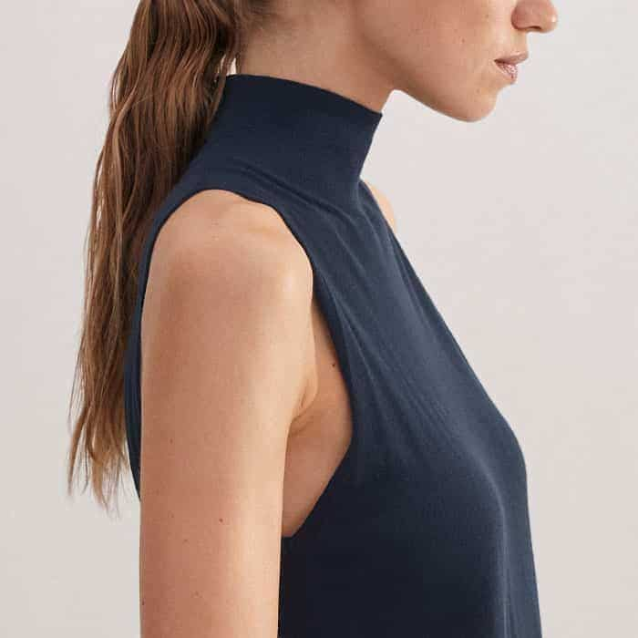 The halter armhole positioning creates a flattering yet modern fit.