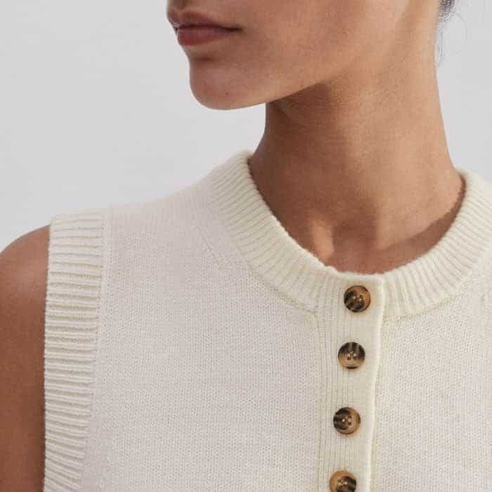 The neckline, armholes and hem are ribbed to maintain the shape of the piece.