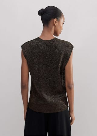 Crafted from a viscose stretch knit with sparkly metallic fibres throughout. 