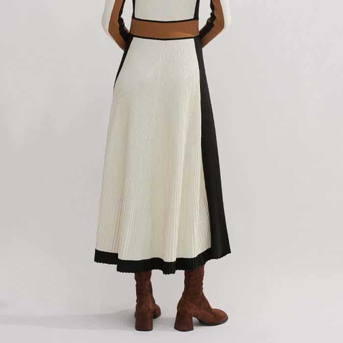 The fitted bodice falls to a flared A-line skirt for a flattering finish.