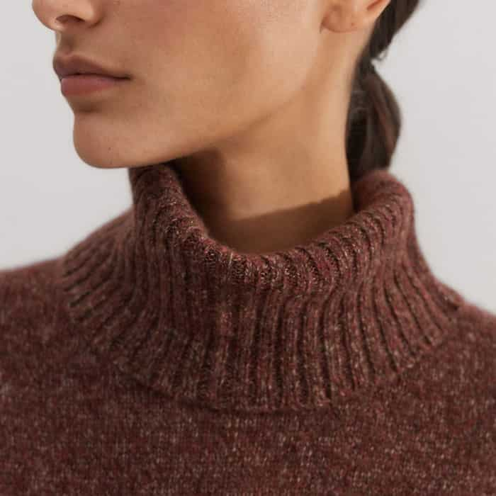 The snood can be buttoned in at the neckline to lock in warmth.