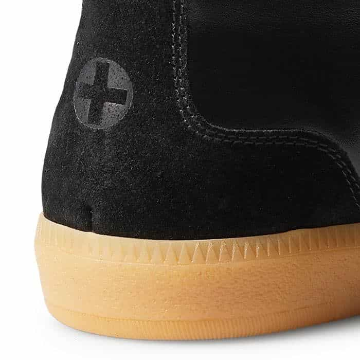 A heat-embossed cross at the heel subtly alludes to our branding.