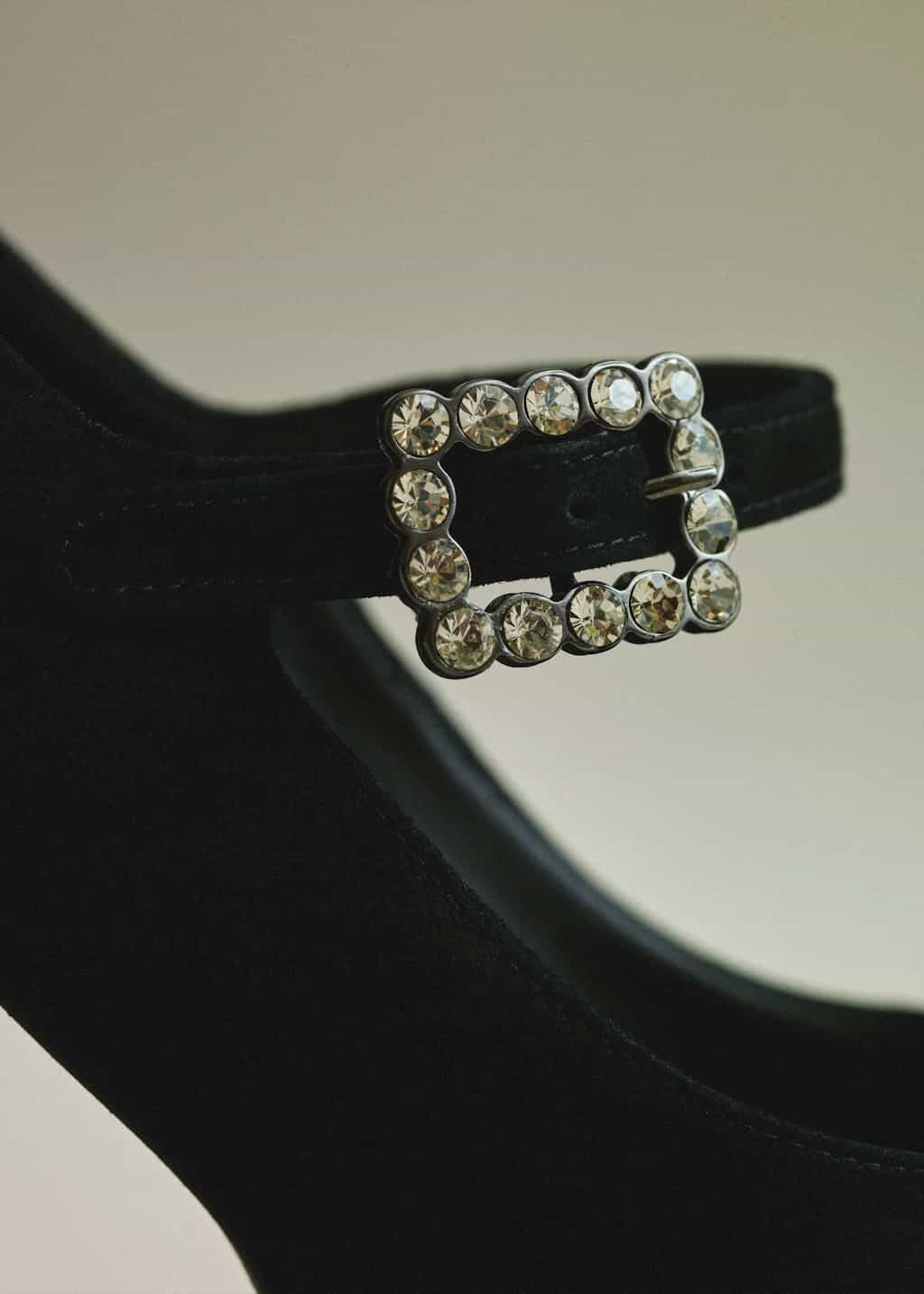 A crystal detail on the strap adds interest to the black colourway.