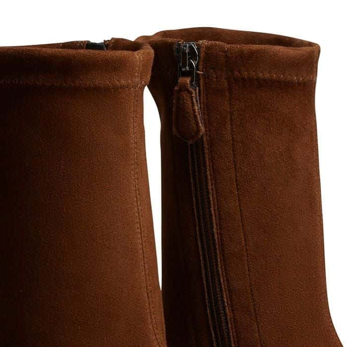 The zip is positioned on the inside of the ankle to keep the outside free from detailing.