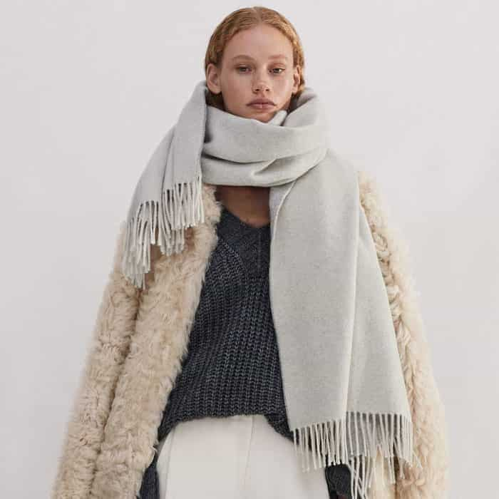 Lock in warmth with our Travel Scarf and Statement Shearling Coat. 