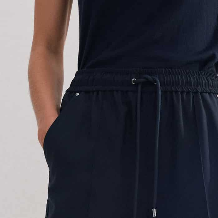 Discreet pockets by the seams deliver practicality without bulk.