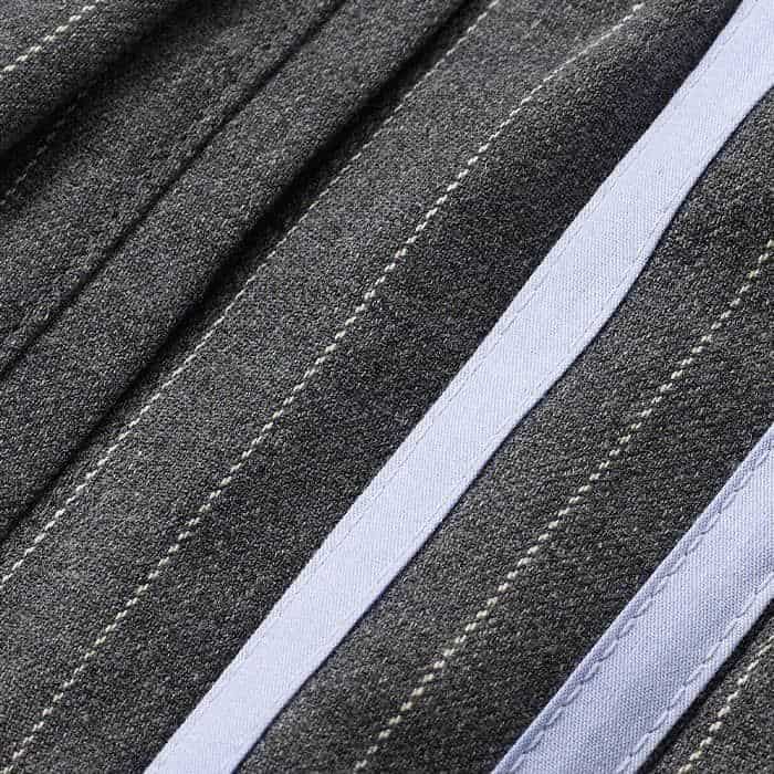 Made from an Italian wool blend fabric in a pinstripe pattern.