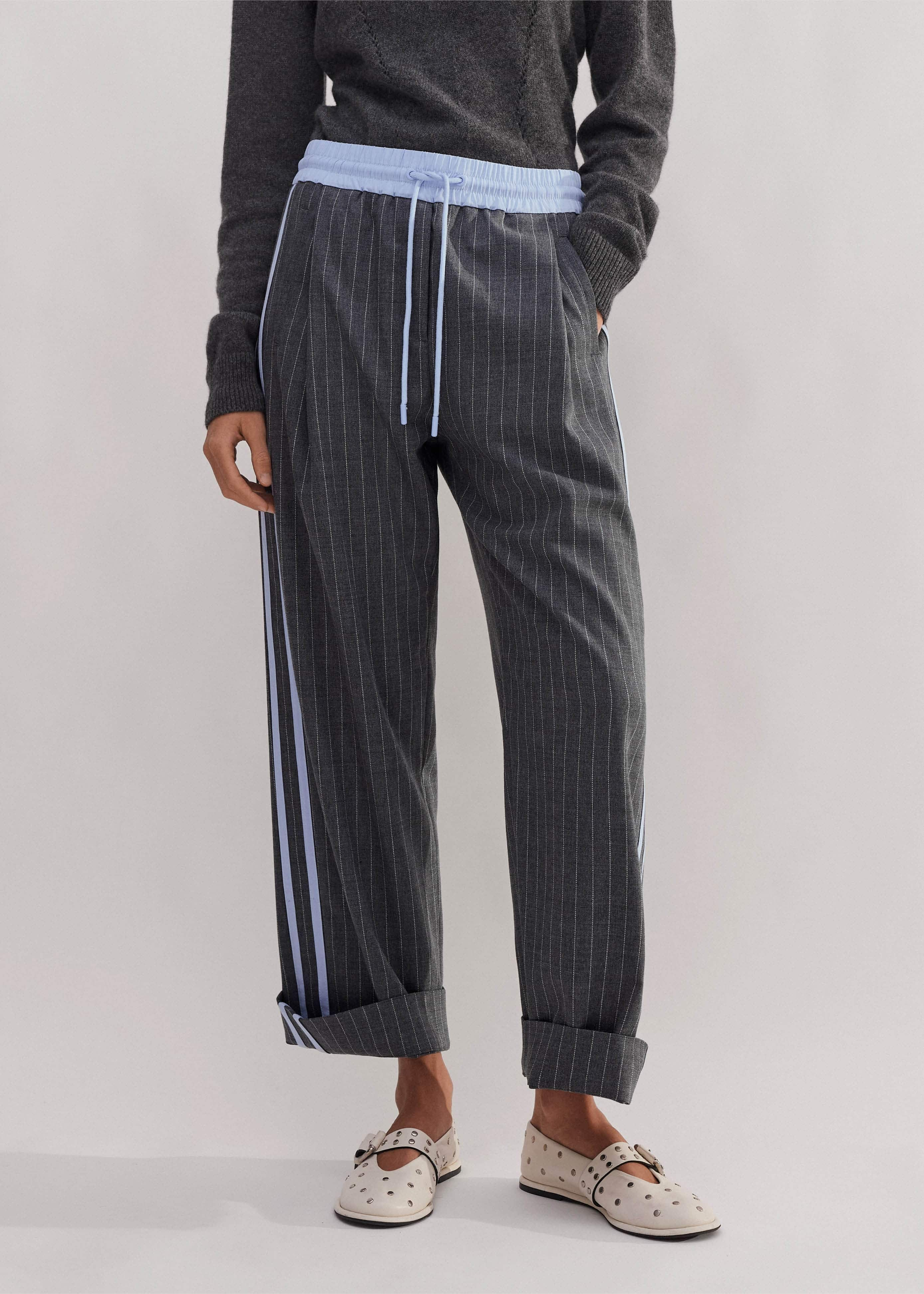 Made from an Italian wool blend fabric in a pinstripe pattern.