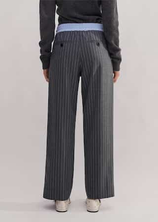 Made from an Italian wool blend fabric in a pinstripe pattern.