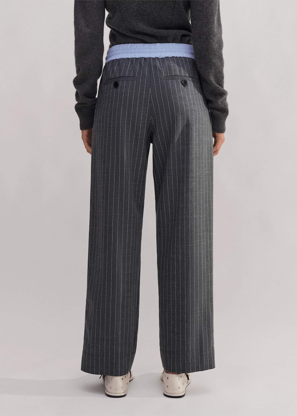 Made from an Italian wool blend fabric in a pinstripe pattern.