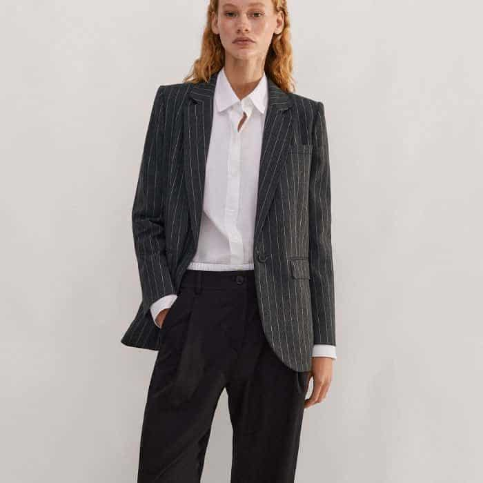 Introduce graphic interest to your look with our Pinstripe Tomboy Blazer.