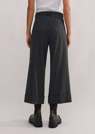 Made from an Italian wool blend fabric in a pinstripe pattern.