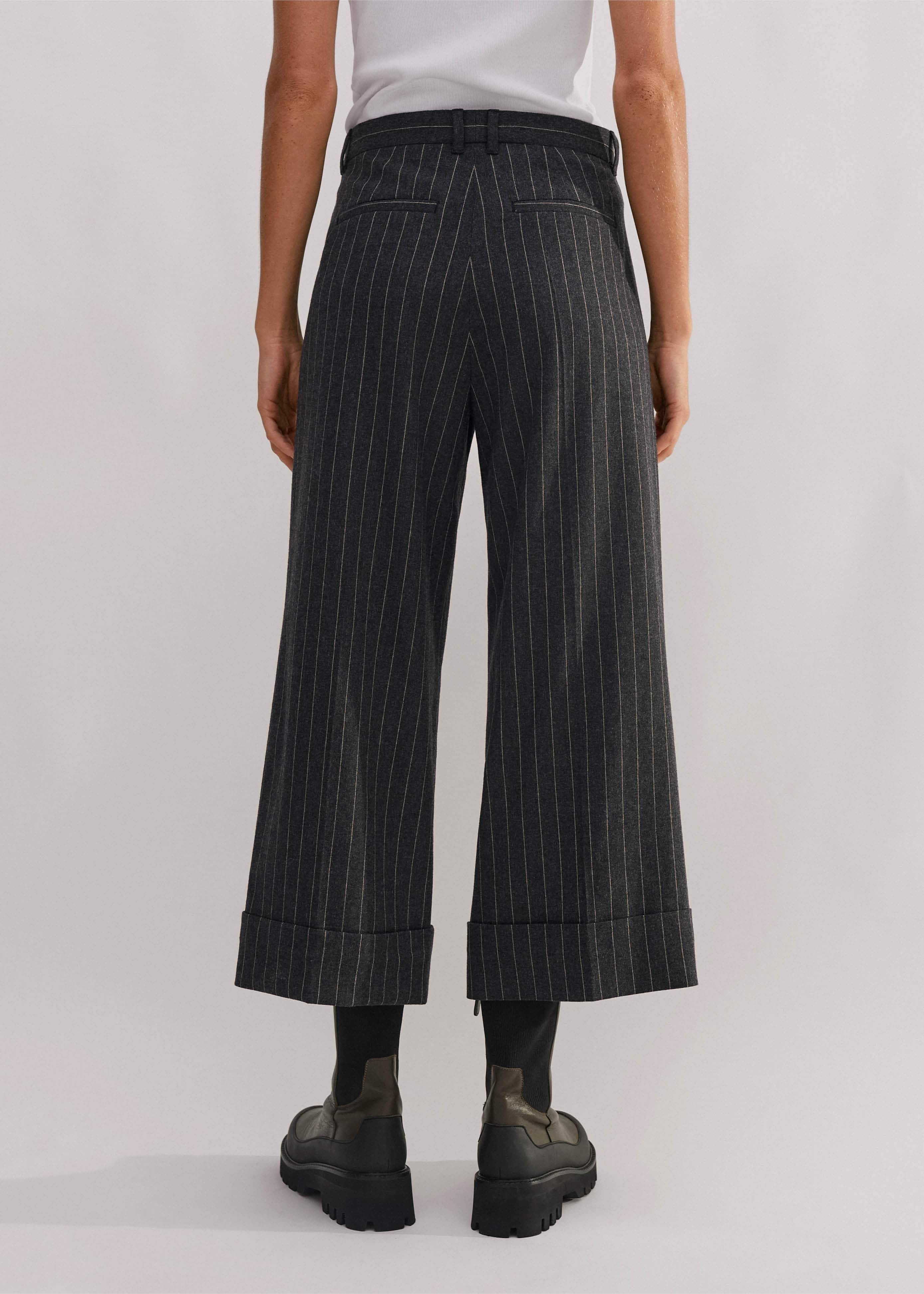 Made from an Italian wool blend fabric in a pinstripe pattern.