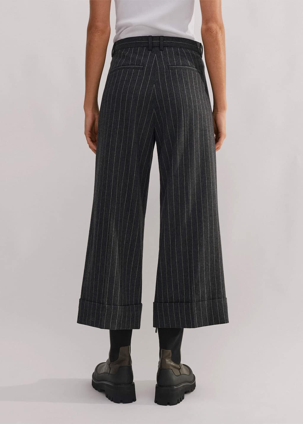 Made from an Italian wool blend fabric in a pinstripe pattern.