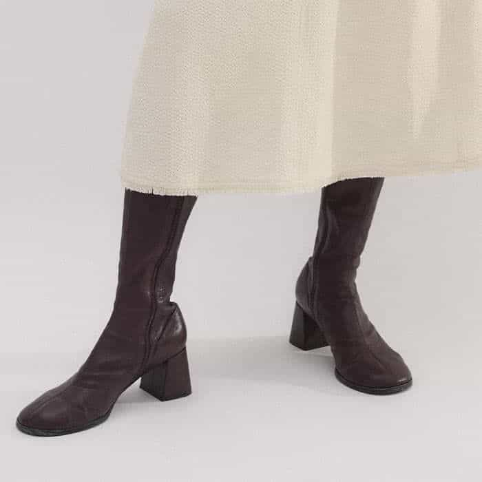 Our Stretch Knee-High Boot complements the midi length of the dress.