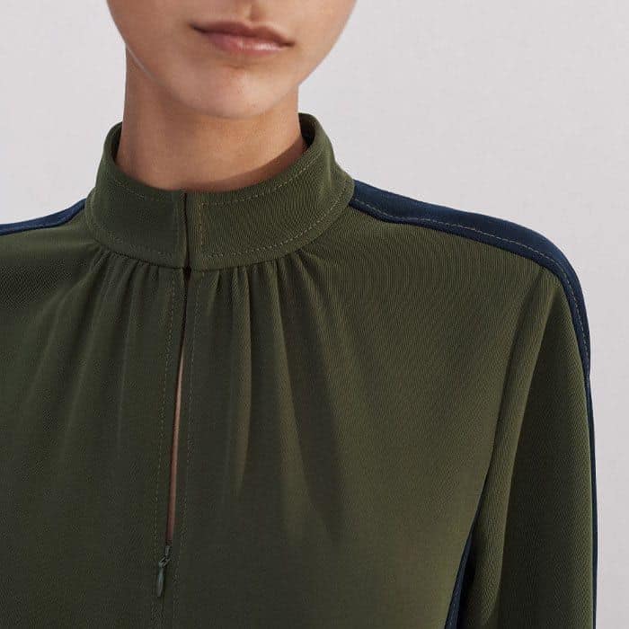 A zip fastening at the neckline allows for a customisable finish.